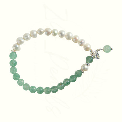 BRACELET with green beads and pearls on a white background