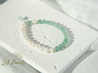 Pearl and green bead bracelet on a white heart-shaped card with 'ZG Pearls' branding.